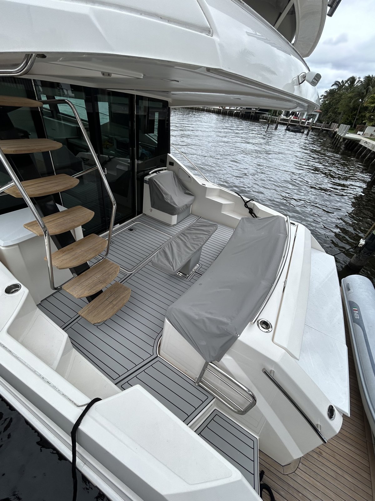 Cockpit sole on a sportfish, storm gray planking, dockside view