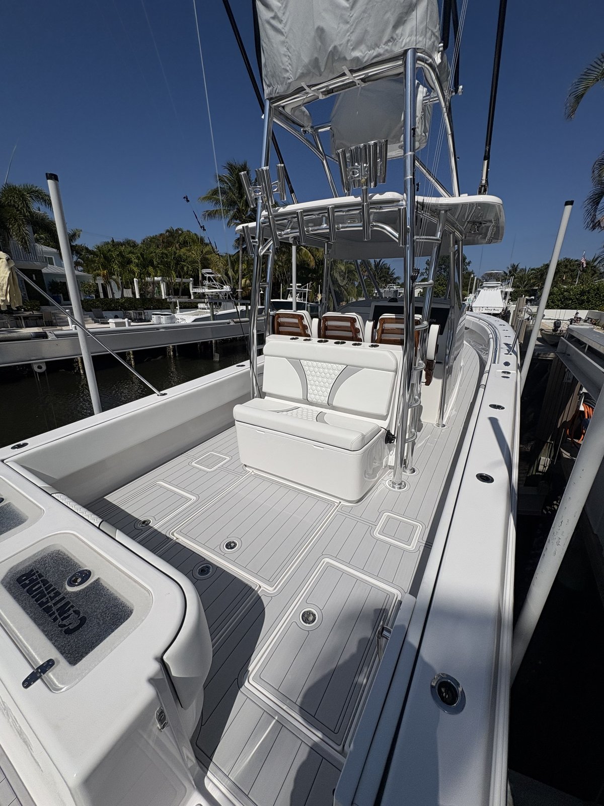 Cockpit and helm seating on a Contender center console, ivory planking with gray inlays