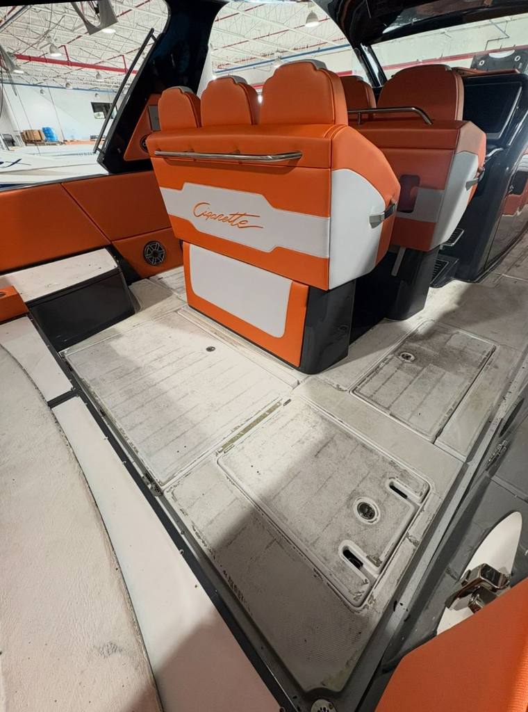 The same cockpit before: bare, stained fiberglass non-skid